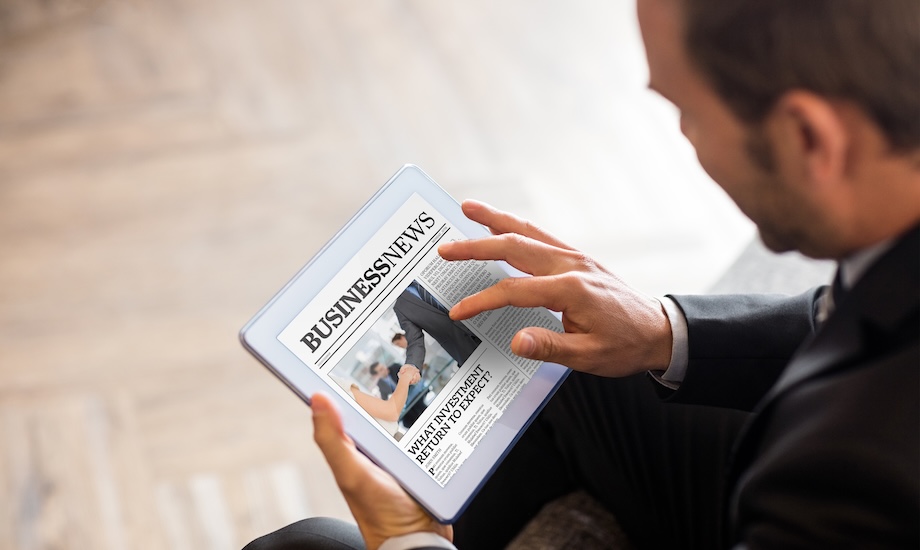 a man reading press release about business